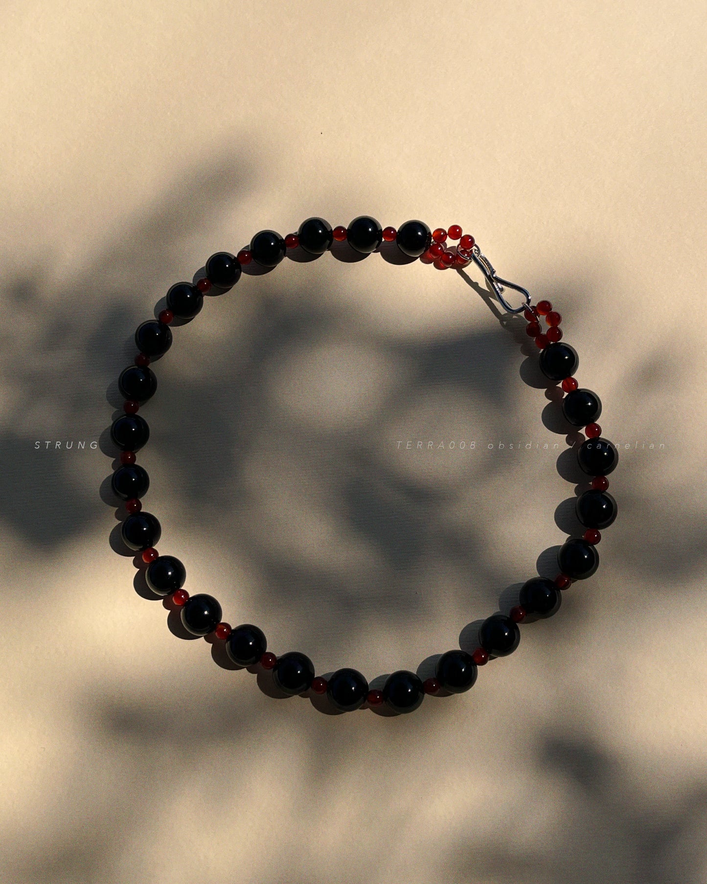 STRUNG TERRA008 - obsidian / carnelian