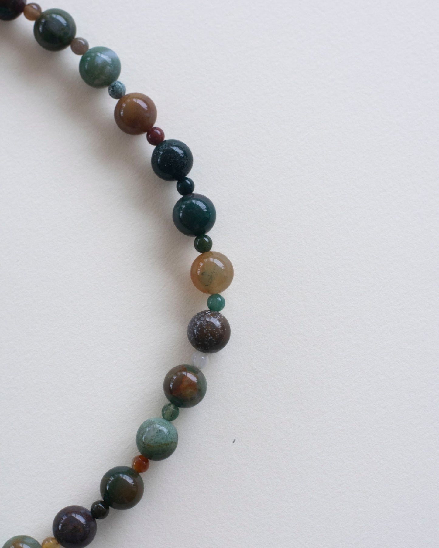 indian agate beaded Necklace with multicolored beads on a white background