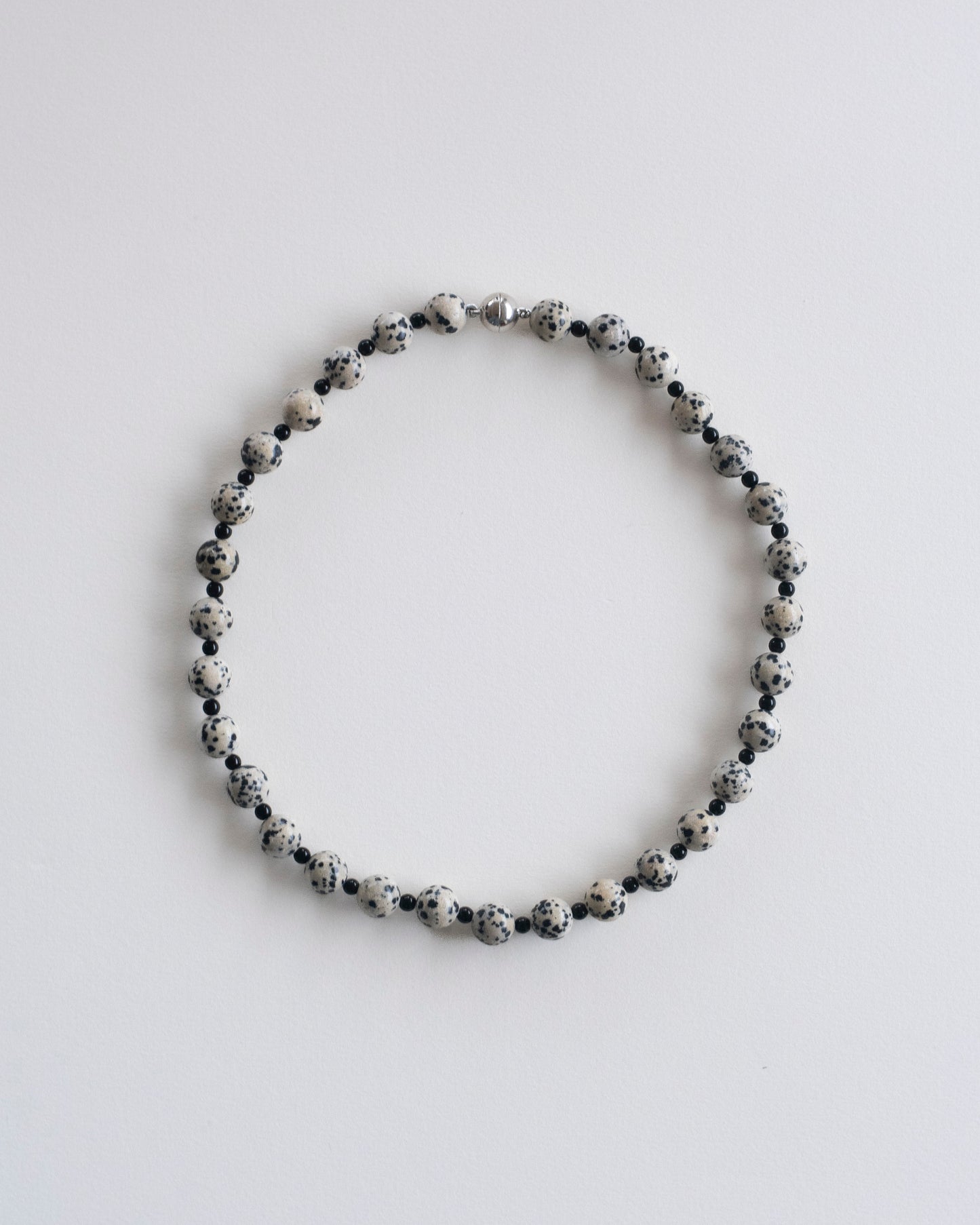 flat view of dalmatian jasper and onyx beaded necklace