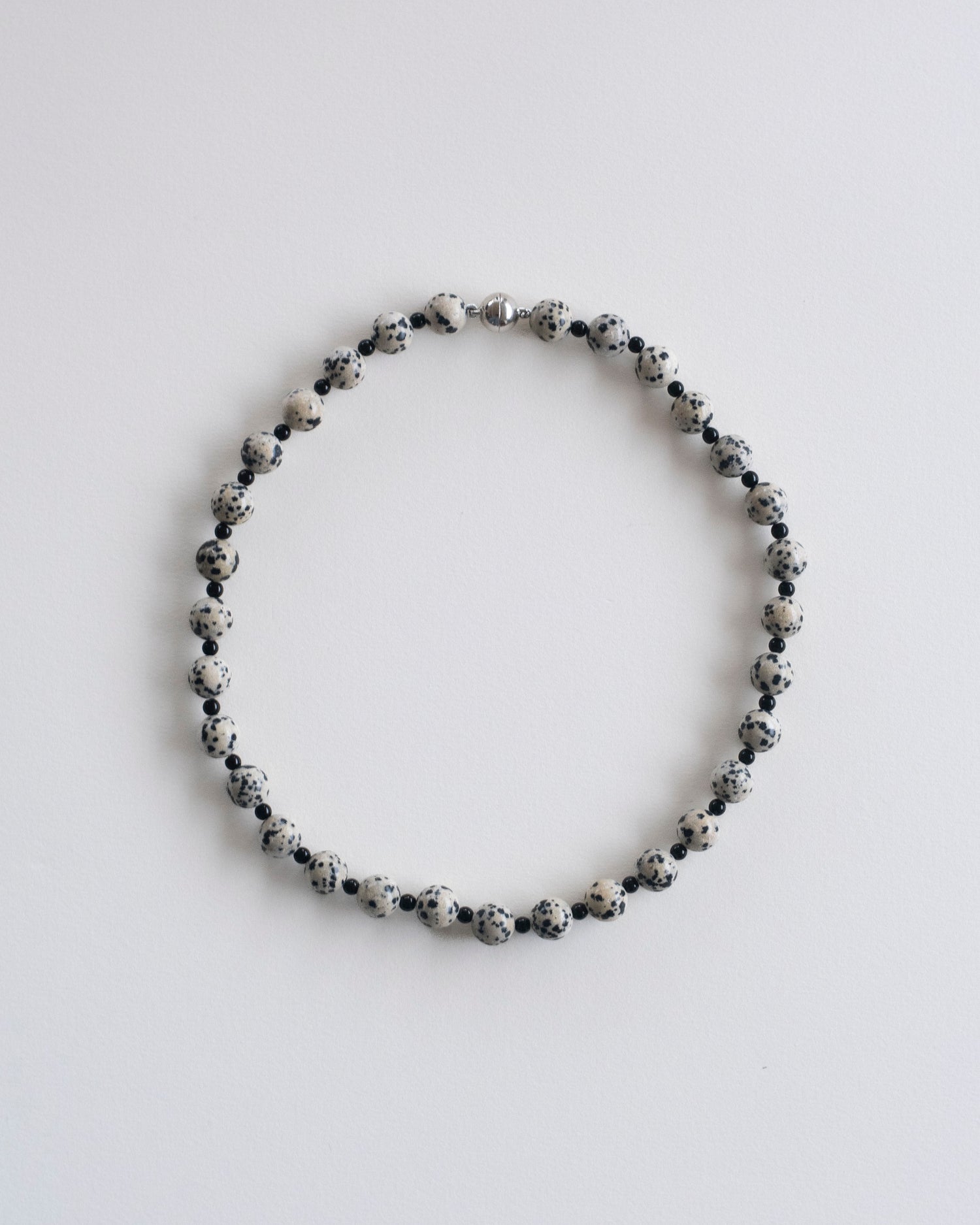flat view of dalmatian jasper and onyx beaded necklace