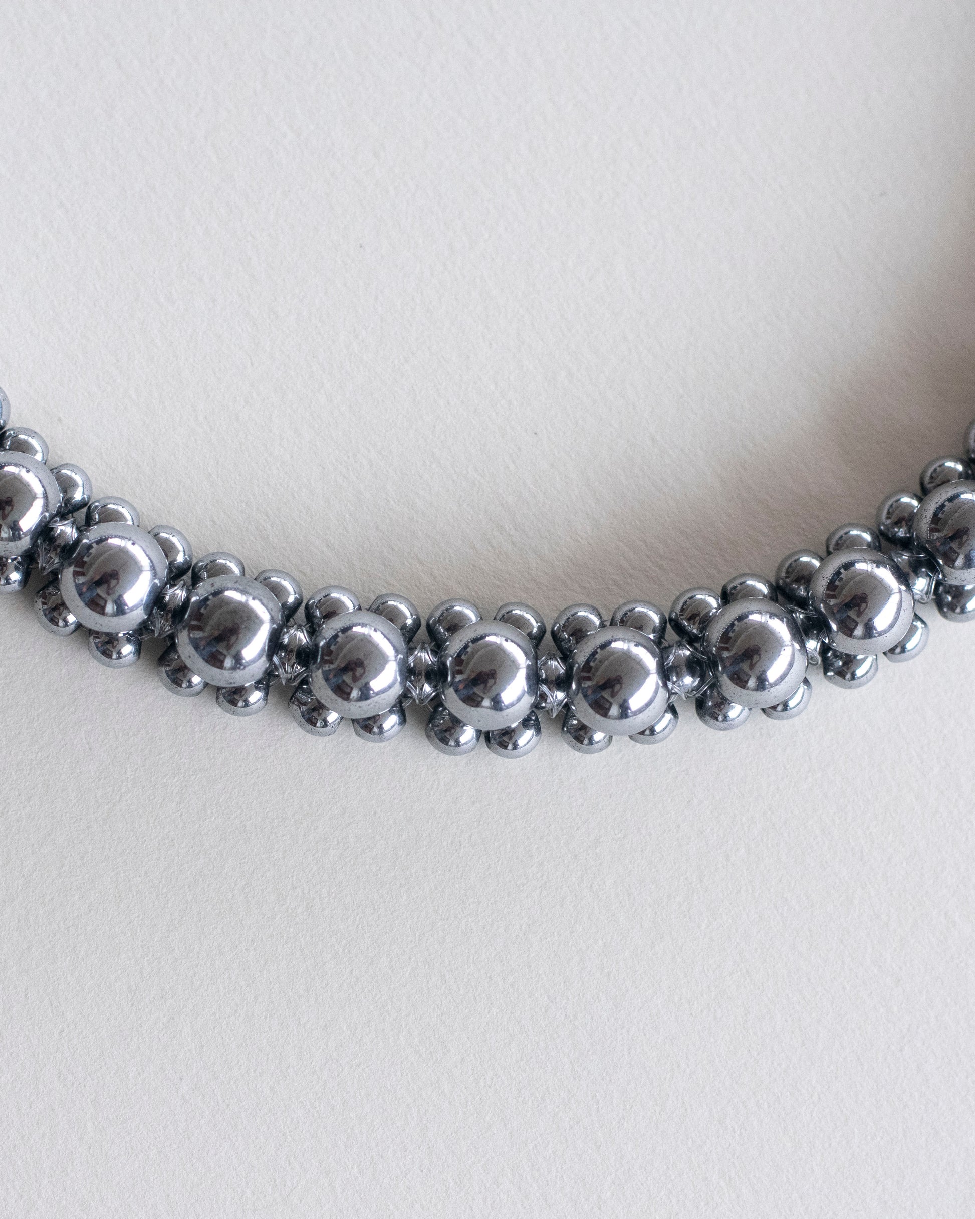 Silver hematite beaded necklace on a white background