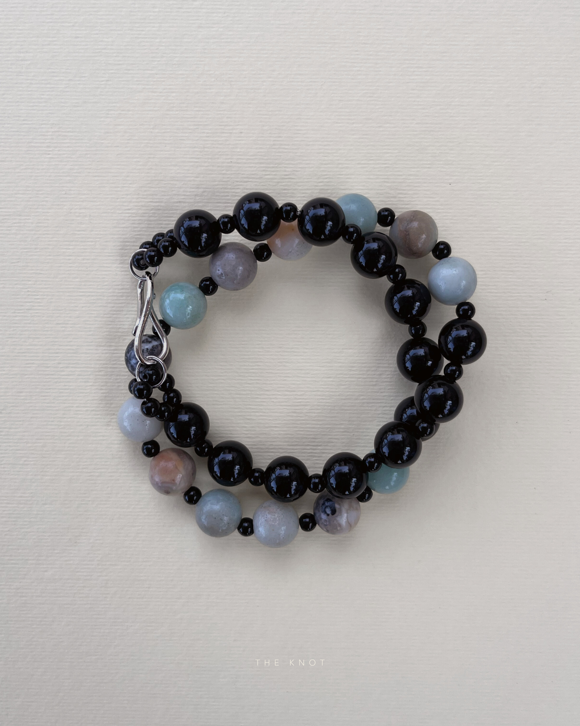 Handstrung TERRA010 duo necklace showing the contrast between amazonite and obsidian beads with black onyx spacers