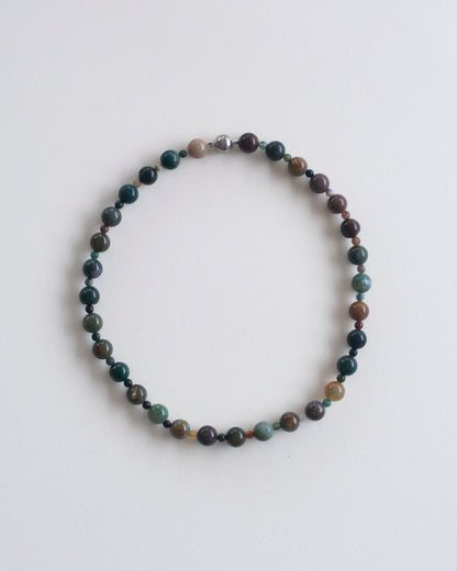 flat view of indian agate beaded necklace on a light gray background